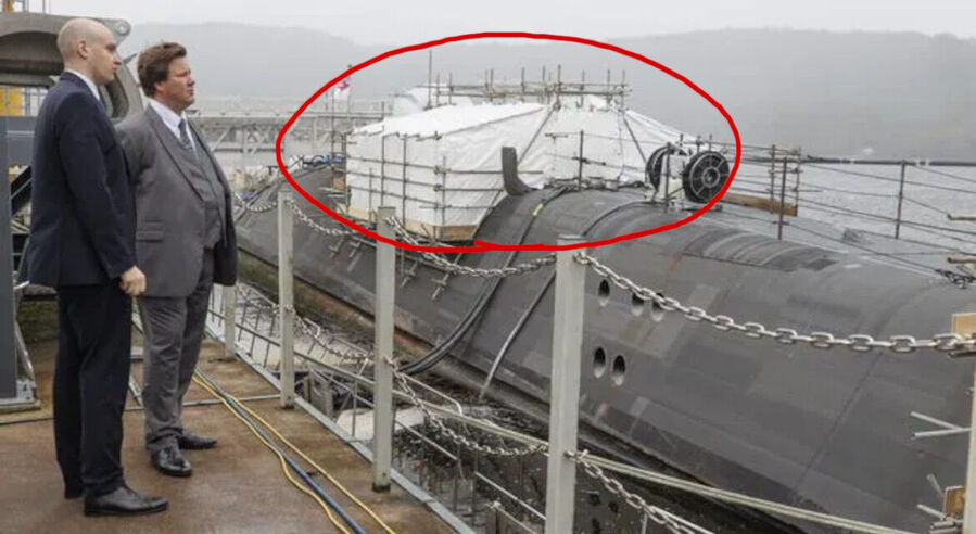 Click to enlarge Alec Shellbrooke inspects submarine