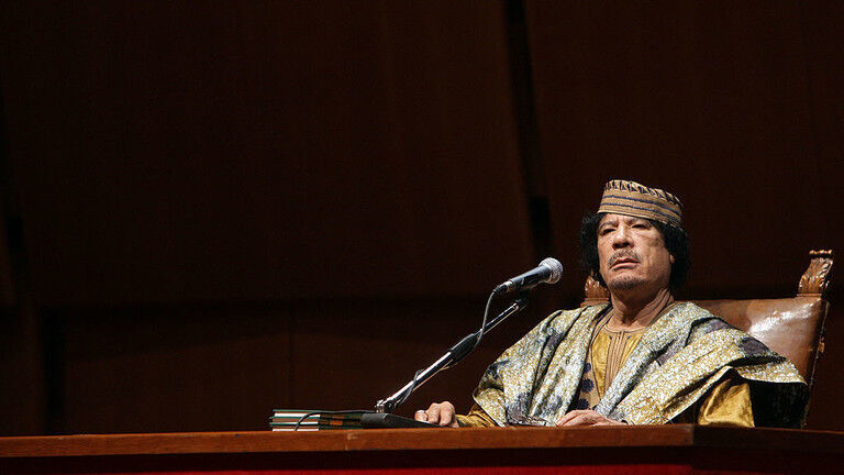 Click to enlarge FILE PHOTO: Lybia's Leader Muammar Gaddafi attends a meeting with seven hundred Italian women at the Auditorium Parco Della Musica on June 12, 2009 in Rome, Italy.