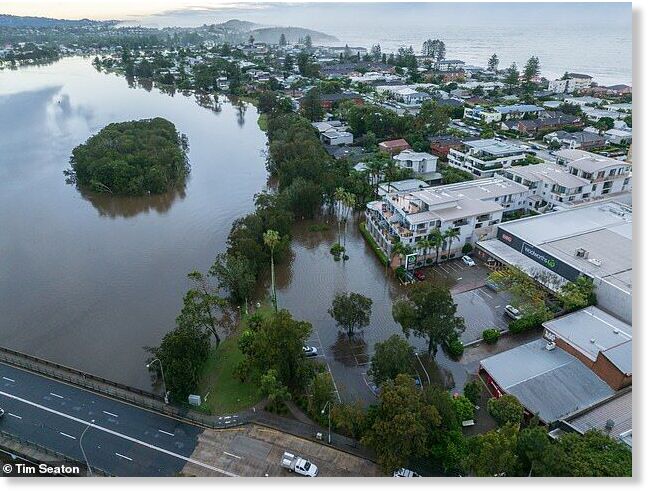 More than a month's worth of rain fell across parts of eastern NSW on Friday, leading to fears of widespread flooding (pictured, Narrabeen on Sydney's northern beaches)