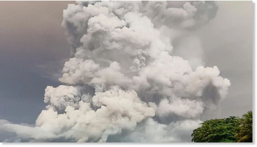 An eruption from Mount Ruang volcano is seen from neighbouring Tagulandang island