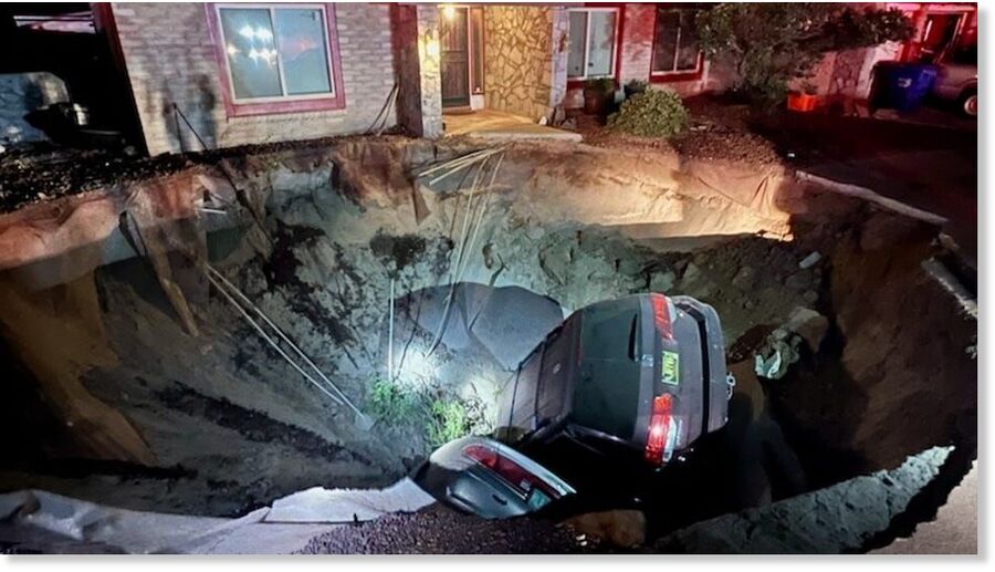 Click to enlarge A large sinkhole on the 1700 block of Regal Ridge Street