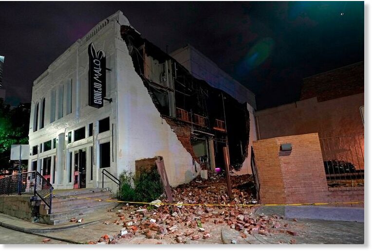 Click to enlarge A damaged building is shown in the aftermath of a severe thunderstorm that passed through downtown, May 16, 2024, in Houston.