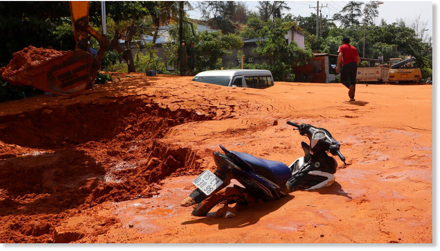 Motorbikes parked on the streets are also buried in the sand.