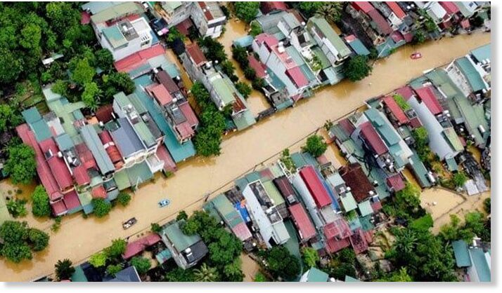 Click to enlarge Flood waters submerged buildings after heavy rain in Ha Giang city in northern Vietnam on June 10, 2024.