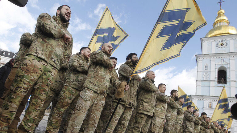 Click to enlarge FILE PHOTO. Azov Battalion with flag