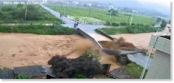Click to enlarge A bridge collapses following heavy rainfall and flooding in Dongshi Town, Meizhou City, Guangdong Province, China June 16, 2024, in this still image obtained from social media video.