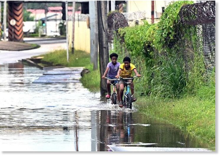 Taking a chance: Two boys ride their