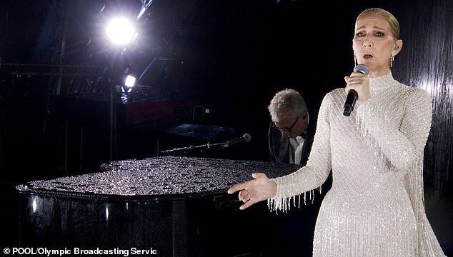 Click to enlarge Celine Dion was praised by viewers for saving a rain-soaked opening ceremony in her first public performance since being diagnosed with stiff person syndrome