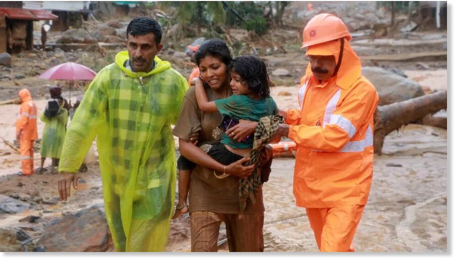 Rescuers help residents move to safety