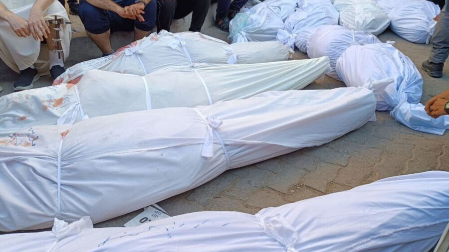 Click to enlarge The photo shows dead bodies in the aftermath of an Israeli bombardment of a school sheltering displaced Palestinians in the east of Gaza City on August 10, 2024.