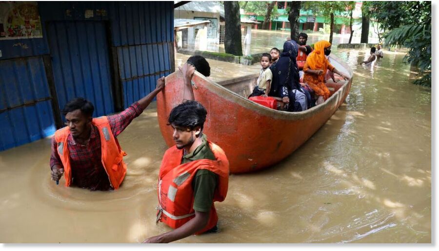 Click to enlarge Volunteers rescue people on a boat after several districts flooded at Chhagalnaiya in Feni, Bangladesh, August 23, 2024.