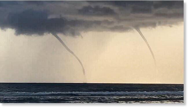 Two giant waterspouts are spotted over the sea in Italy's Fregene amid ferocious summer storms.
