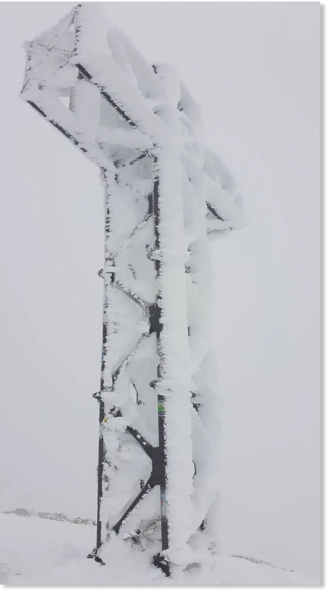 Click to enlarge The peak cross at Marmolada, Italy.