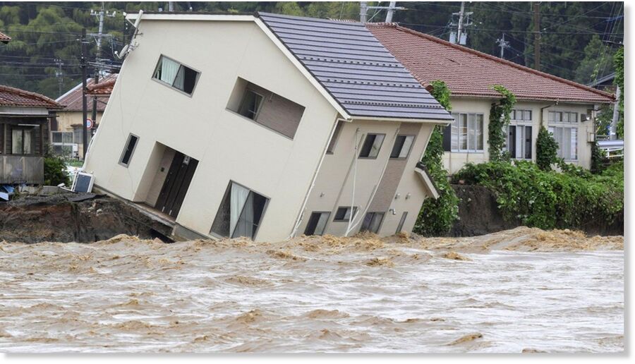 A house hangs over the banks of a river in Suzu