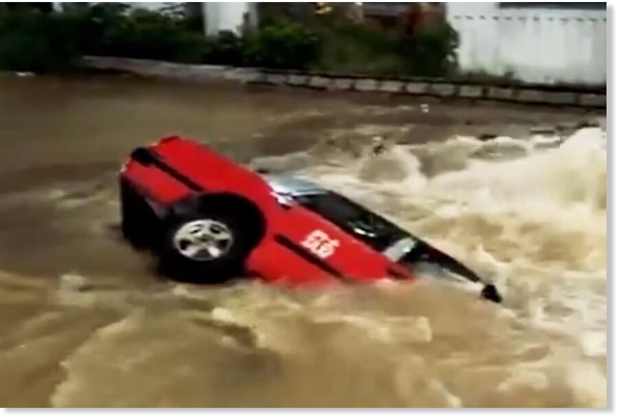 Hong Kong taxi plunges into sinkhole