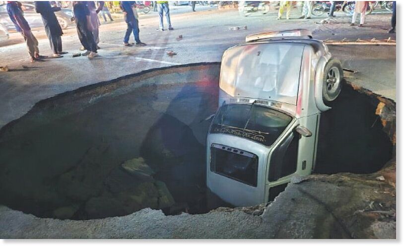 A four-wheeler falls into a sinkhole which appeared at Khayaban-i-Firdausi, Johar Town.