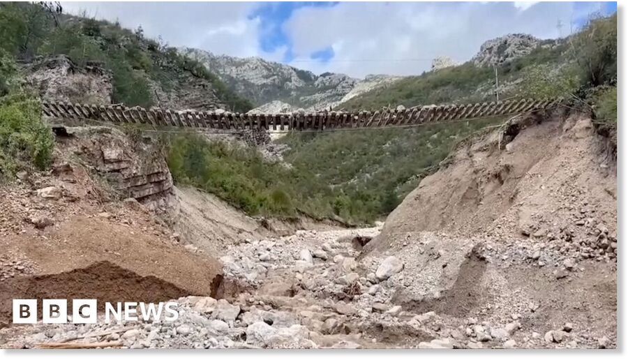 Train track left hanging in the air after Bosnia landslides