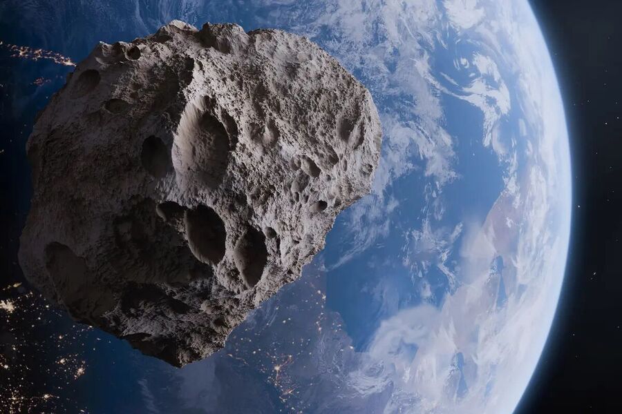 An illustration shows an asteroid orbiting the Earth.