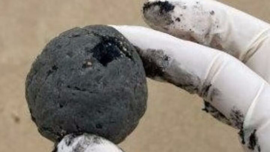 Click to enlarge tar balls beach coogee australia