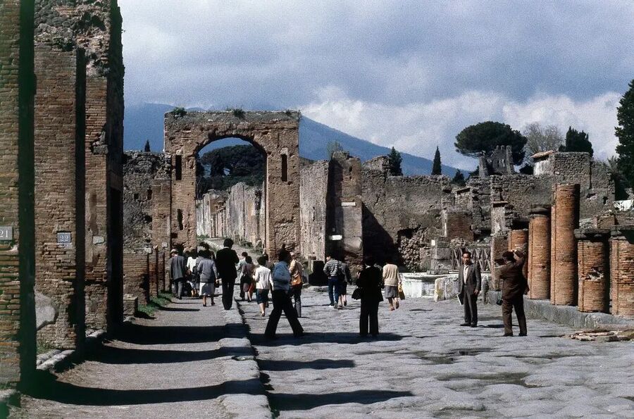 Click to enlarge People walk through the husk of Pompeii, in 1979, 1,900 years after it was engulfed in ash and lava when Mount Vesuvius erupted.