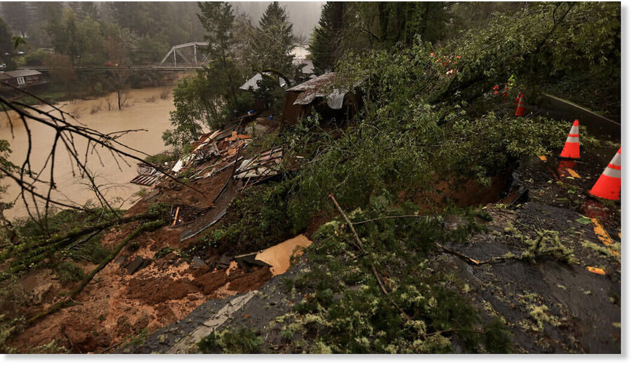 A large slide takes out a home and garage on Westside Road, Tuesday, February. 4, 2025 in Forestville, dumping in to the Russian River.