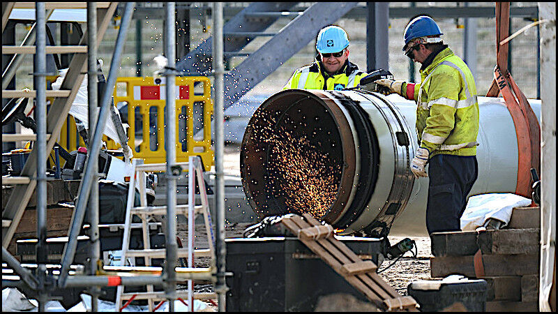 Click to enlarge Pipeline workers
