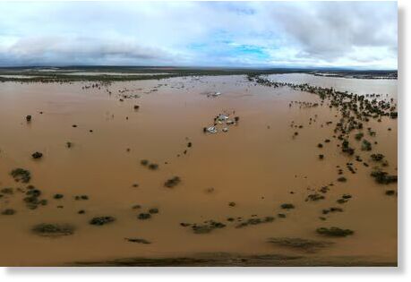 Click to enlarge Homes under flood waters in the town of Windorah in central-west Queensland.