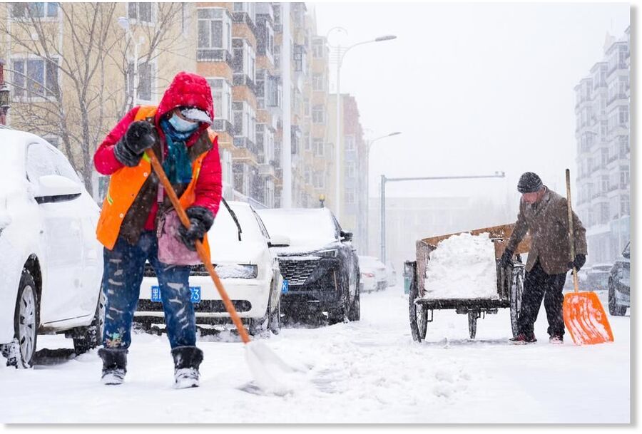 Click to enlarge Sanitation workers clean snow in the Greater Khingan Range, northeast China's Heilongjiang Province, April 12, 2025.