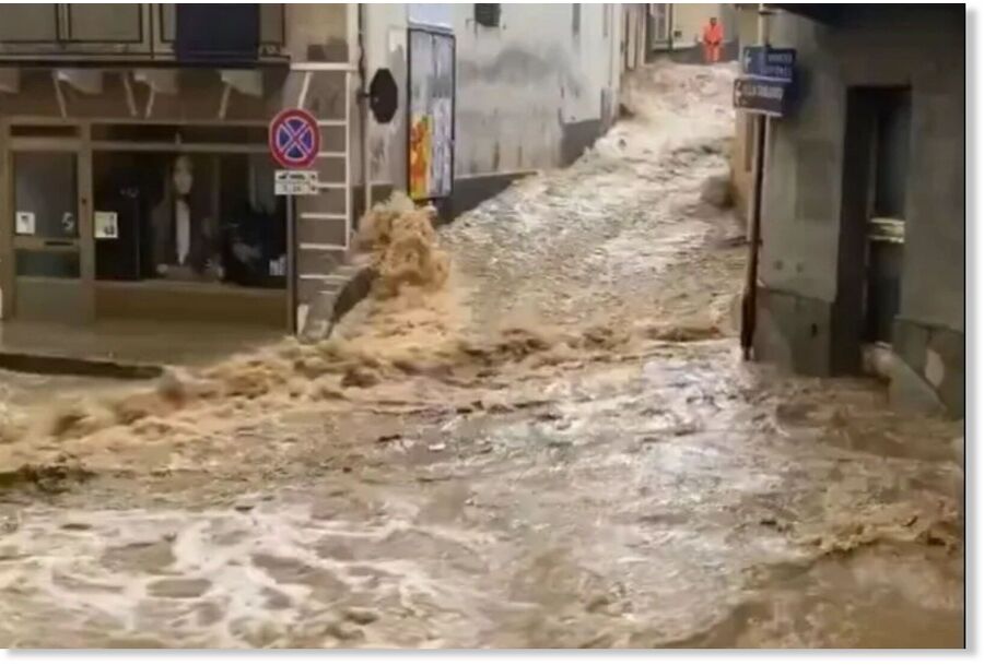 Torrents of water flooded through narrow streets in the Piedmont region