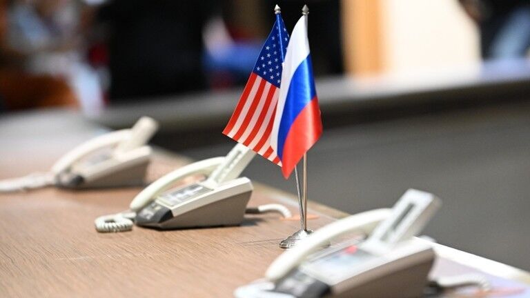 FILE PHOTO: The flags of Russia and the United States.