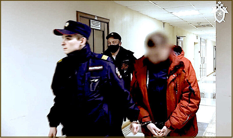 person in handcuffs
