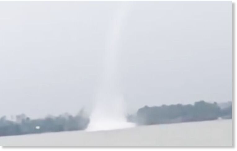 A waterspout is spotted over a river in Tra Cu District, Tra Vinh Province, southern Vietnam, May 15, 2025.