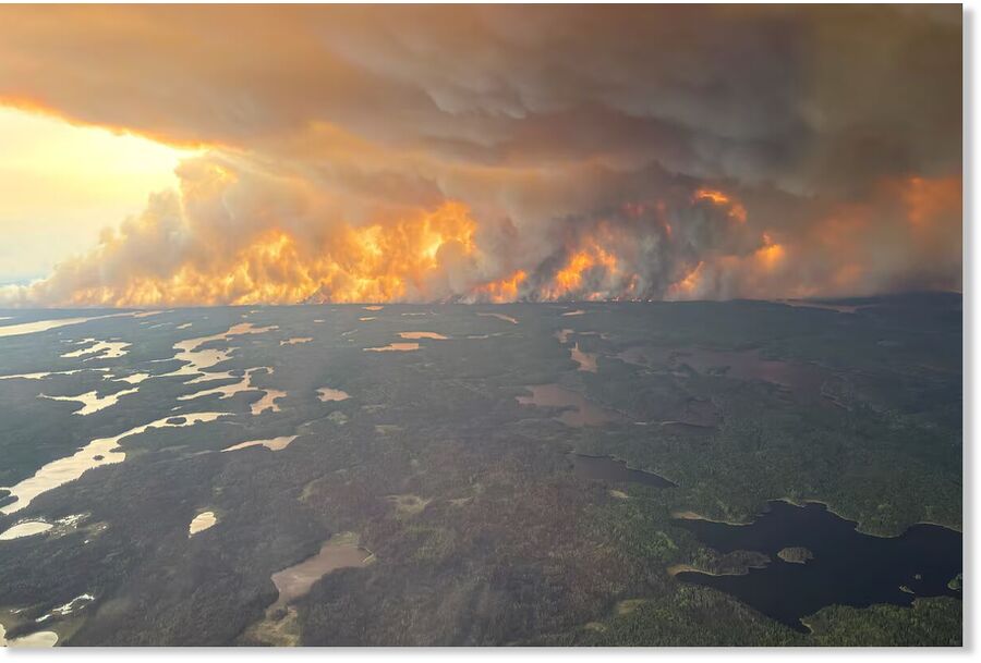 A wildfire in the Flin Flon, Man., area on Tuesday. Mostly firefighters were left behind after the city evacuated.