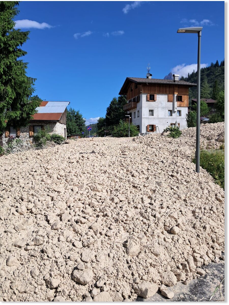 Click to enlarge Tons of rocks and dirt spilled through the village.