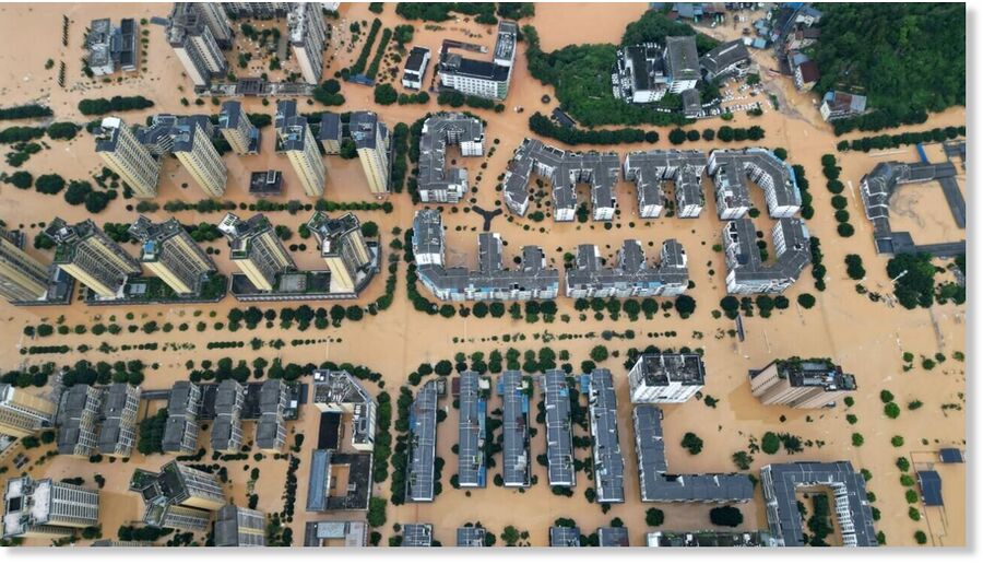 Click to enlarge An aerial photo shows flooded buildings in Rongjiang, in China's southwest Guizhou province on June 24, 2025