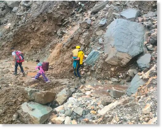 Click to enlarge Passengers are being evacuated on foot near Silai Band on Yamunotri Highway