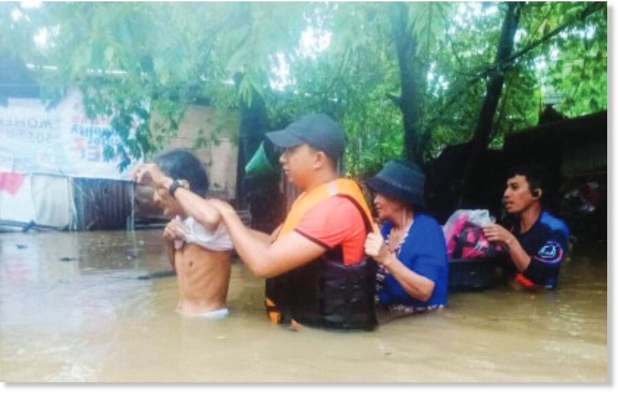 Click to enlarge Flood-hit residents of Barangay Aguisan in Himamaylan City, Negros Occidental, were rescued by personnel of the Philippine Coast Guard yesterday, July 18, 2025.