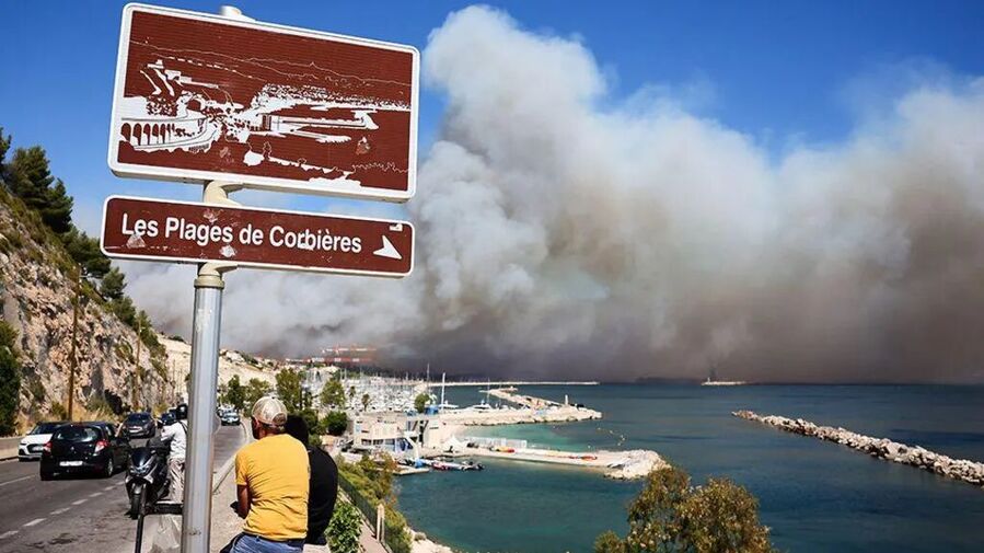Click to enlarge Huge plumes of smoke rose above France's second biggest city