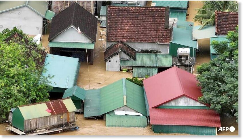 Click to enlarge This aerial photo shows a flooded village in Vietnam's north-central Nghe An province on Jul 23, 2025, following heavy rains brought by tropical storm Wipha.