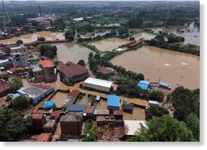 Click to enlarge A drone view shows flooded houses and fish farms after days of heavy rainfall, in Qingyuan, Guangdong province, China August 8, 2025.