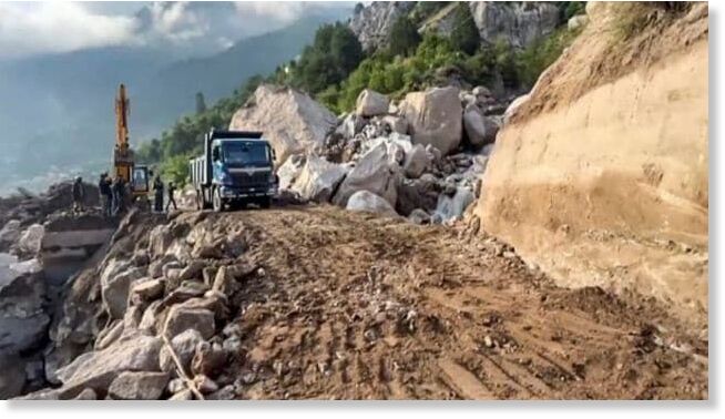 Click to enlarge Debris being cleared from the blocked NH5 following a cloudburst, near Skibba village in Kinnaur district, Friday