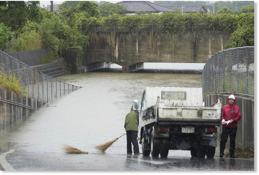 road is flooded follwoing a heavy rain in Nagasu town, Kumamoto prefecture, southern Japan