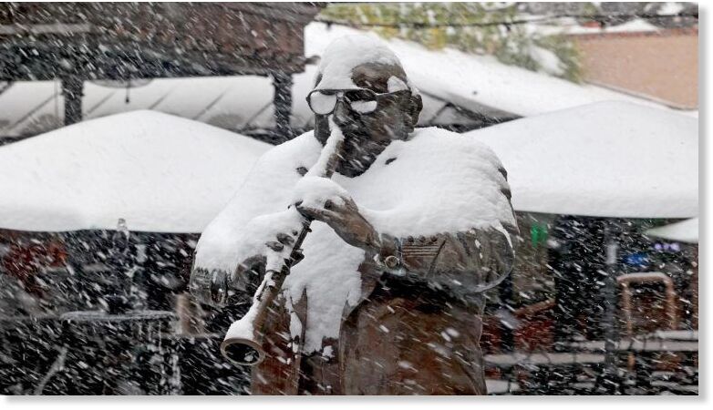 Click to enlarge A statue of Pete Fountain is covered in snow inside New Orleans Musical Legends Park on Bourbon Street on January 21, 2025, in New Orleans, Louisiana.