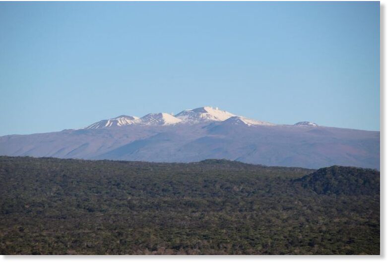 Click to enlarge On February 3, 2025, USGS Hawaiian Volcano Observatory crews on a monitoring overflight of Kīlauea summit had excellent views of the snow-capped Mauna Kea.