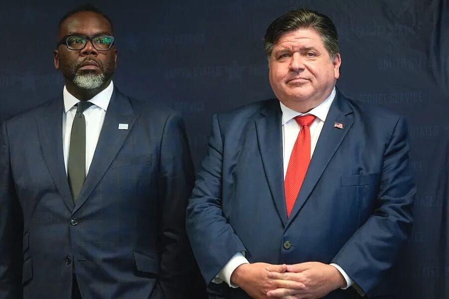 Click to enlarge Illinois Gov. JB Pritzker, right, stands with Chicago Mayor Brandon Johnson