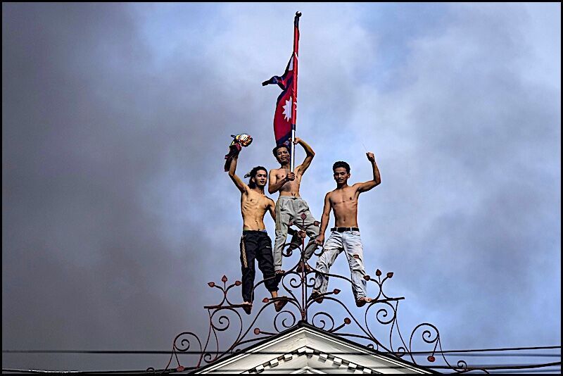 Click to enlarge protesters atop building