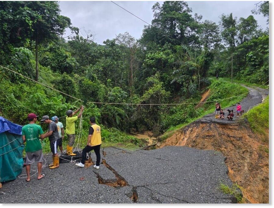Volunteers deliver food and water to stranded Penampang residents after landslides and heavy rain cut off roads.
