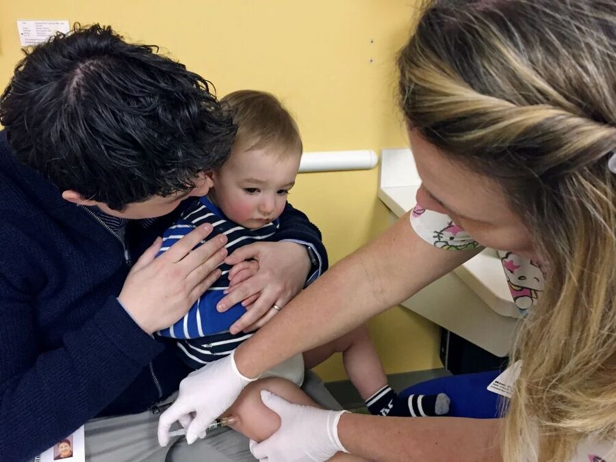 A 15-month-old child get the measles, mumps and rubella booster shot