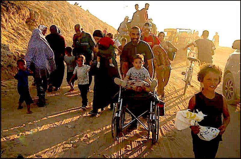 palestinians walk Gaza