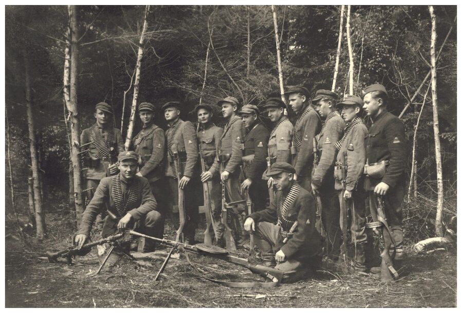 Click to enlarge Lithuanian Forest Brothers pose in the woods, 1945